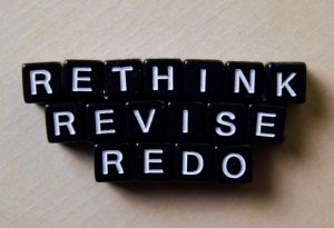 Reflect - Rethink - Redo spelled out on wooden blocks. Business and inspiration concept